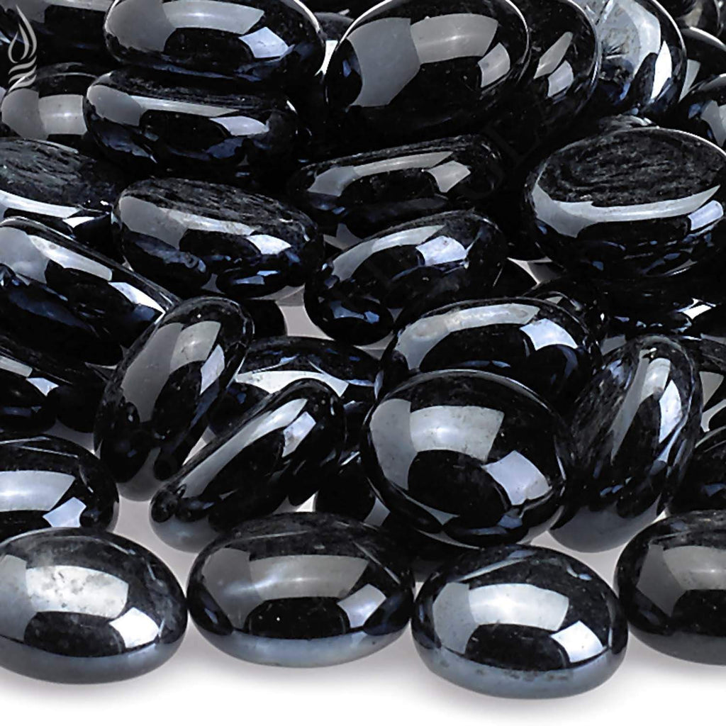 Fire glass beads close-up, dark black oval rounds with reflective highlights