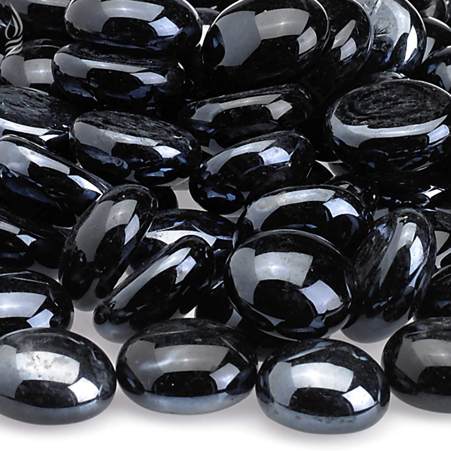 Fire glass beads close-up, dark black oval rounds with reflective highlights
