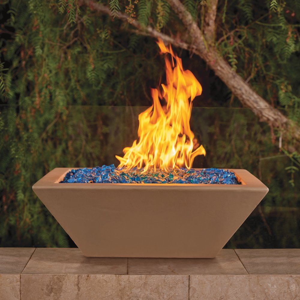 Outdoor concrete gas fire bowl with visible blue burner media and tall orange flame