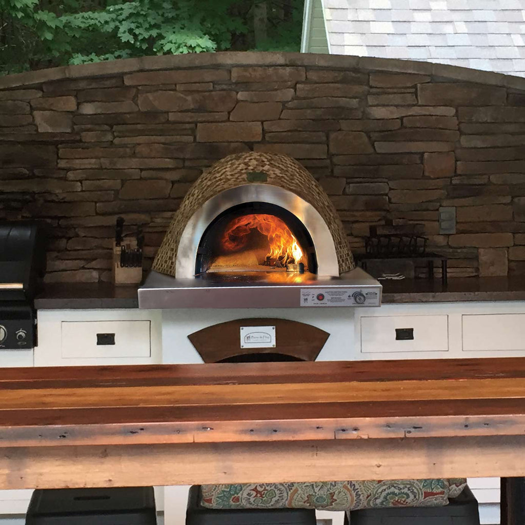 Built-in pizza oven with arched dome, stone-like base, and front control panel