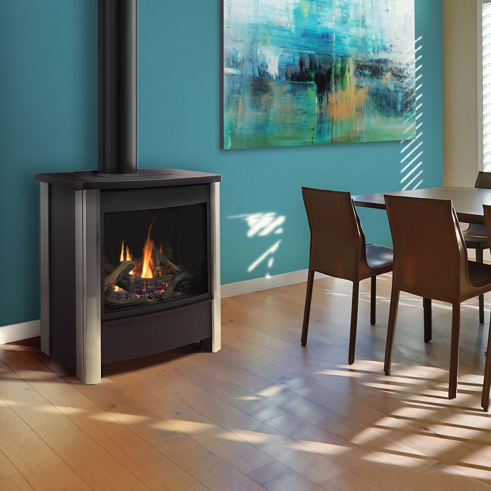 Freestanding gas stove with burning logs visible through glass front