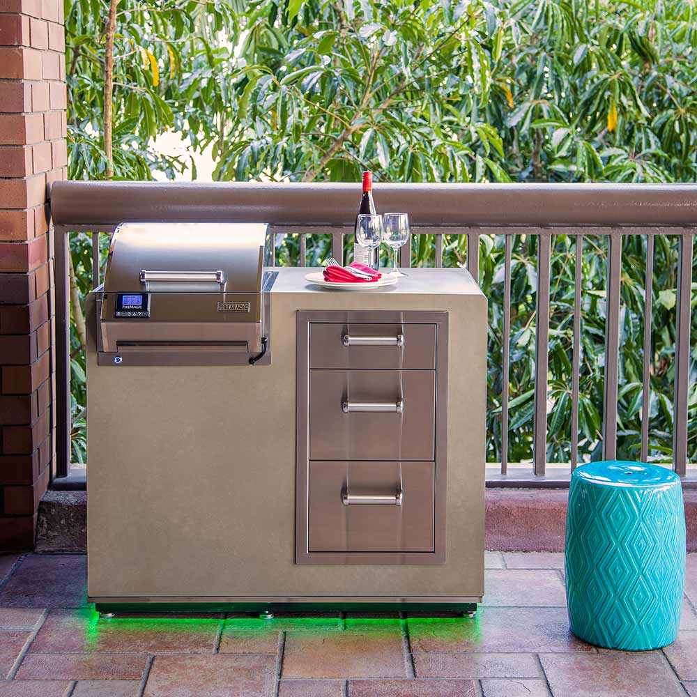 Built-in electric grill with stainless hood, side doors, and front control panel