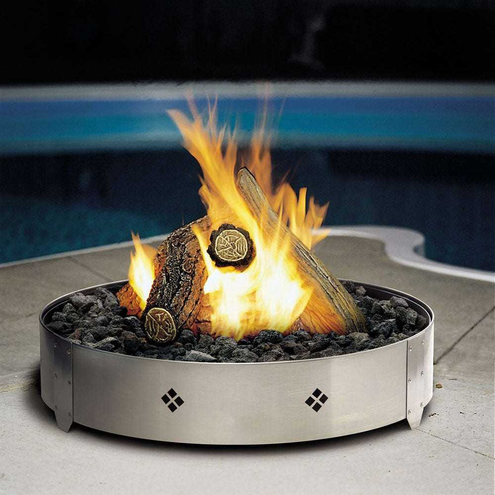 Round gas fire pit burner with stainless ring and active flame on lava rocks