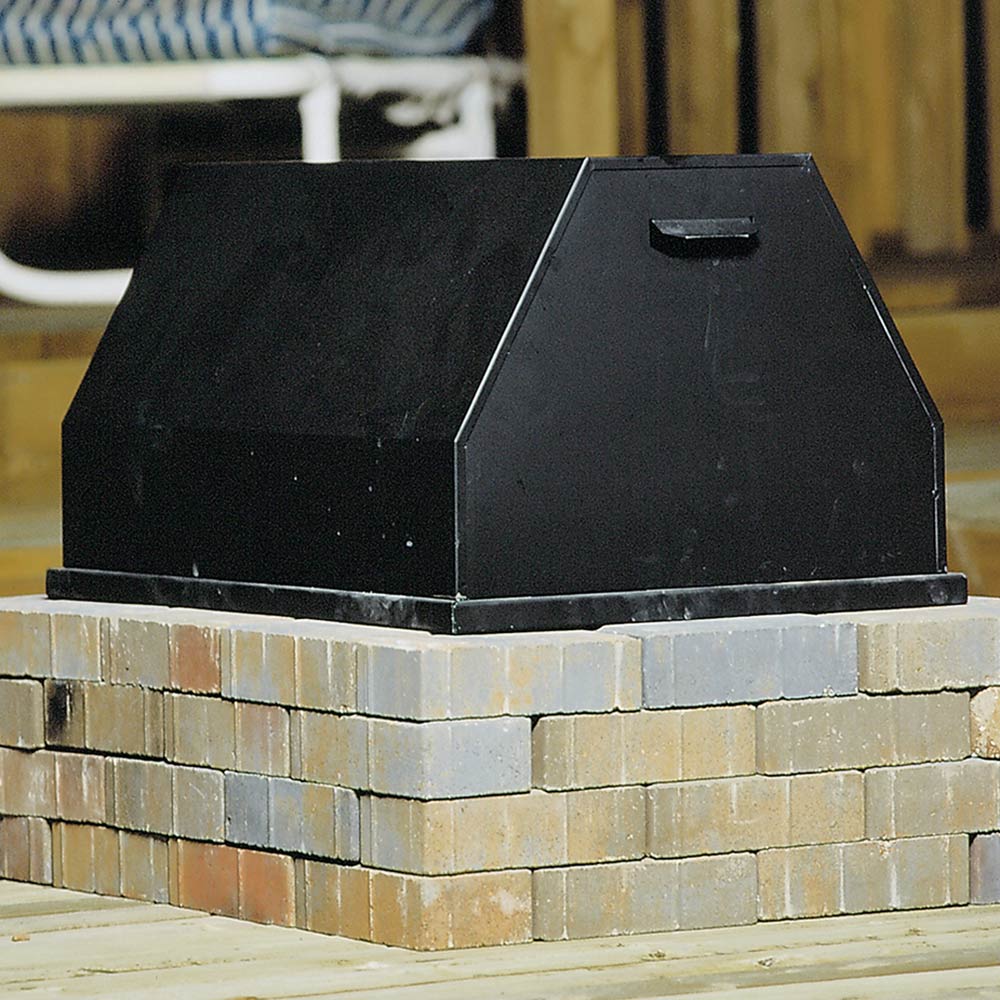 Rectangular black fire pit cover with slanted top and built-in handle