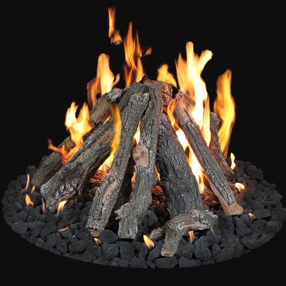 Burning fire pit log set with glowing embers and flame over dark faux logs