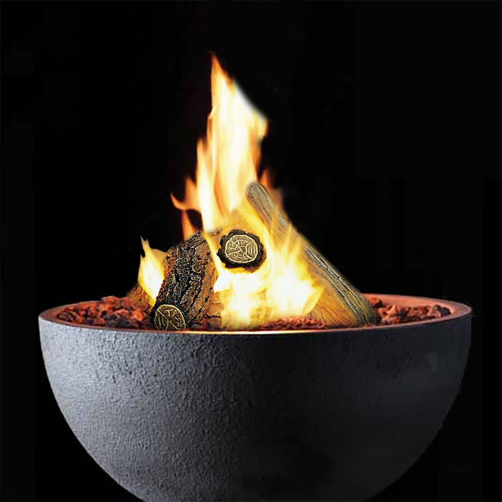 Close-up of a round gas fire bowl with flames over lava rocks, dark gray exterior
