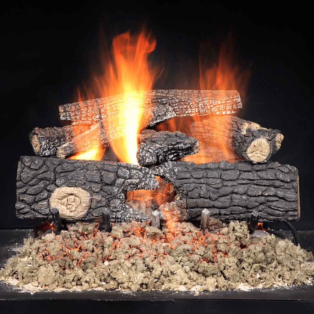 Vented gas log set with faux wood logs and active flames in a firebox