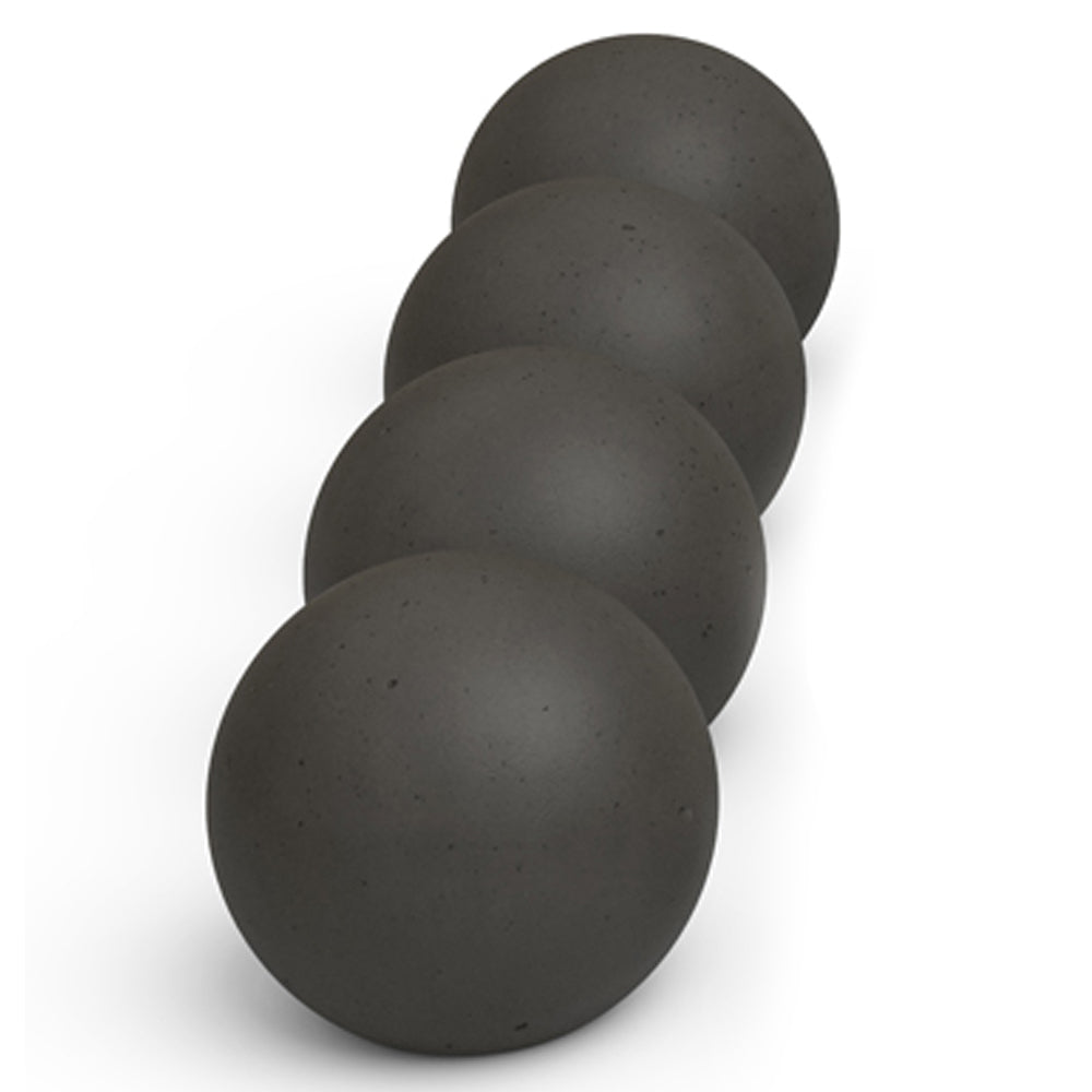 Stack of dark gray matte fire spheres, round concrete ball set