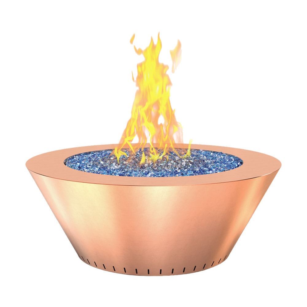 Round copper gas fire table with blue lava rock and tall orange flames