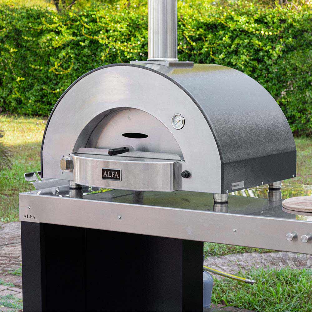 Stainless steel gas pizza oven on outdoor stand with chimney and arched cooking dome