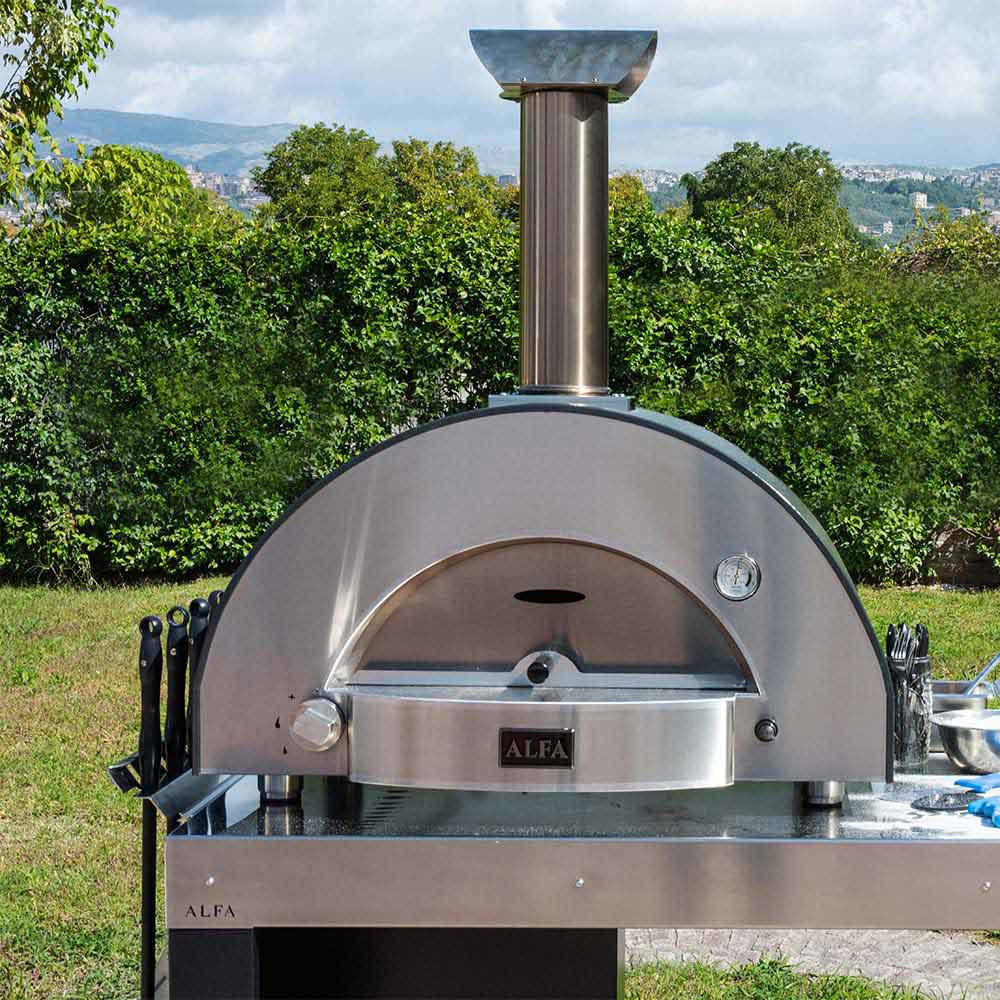 Stainless gas pizza oven with tall flue and arched front opening on base.