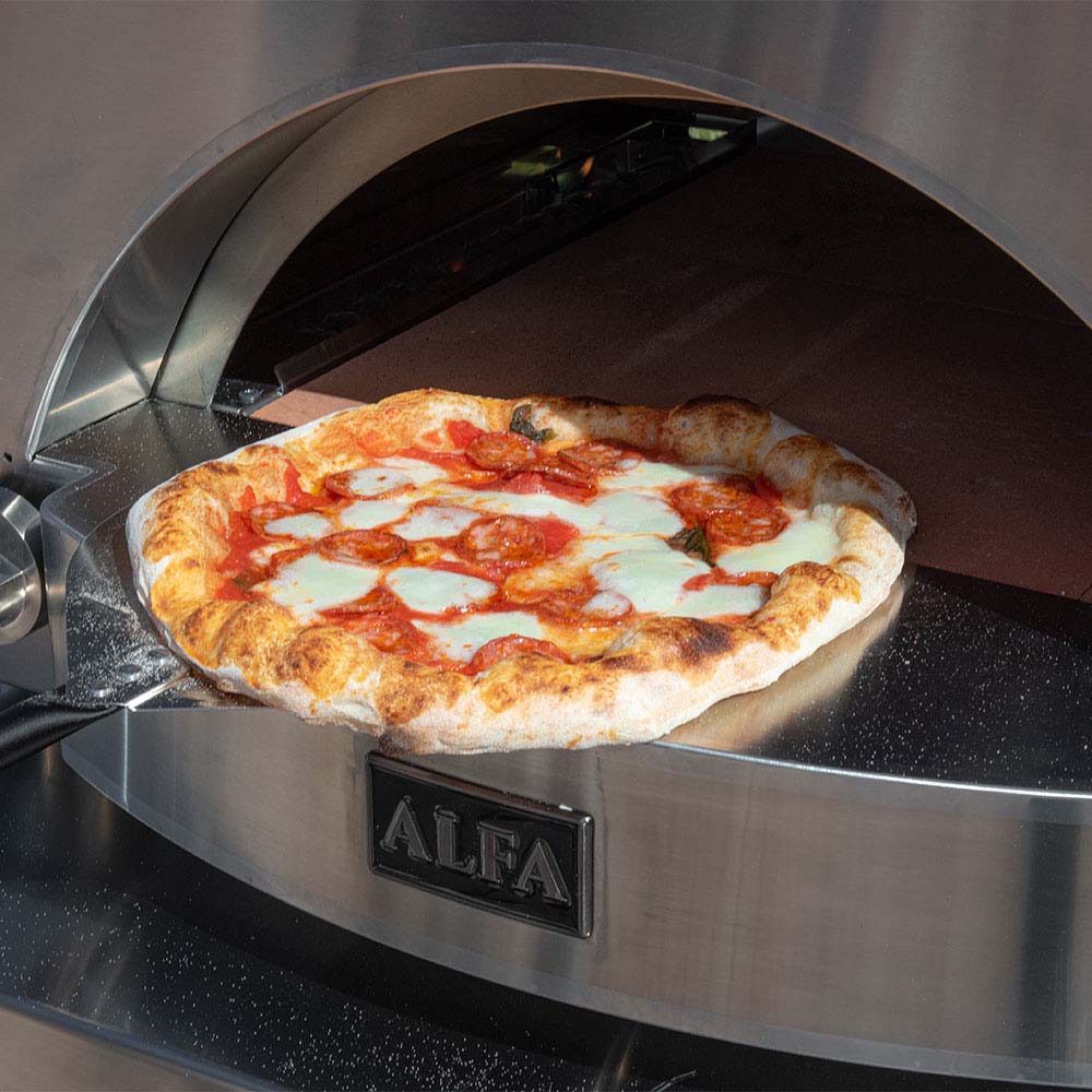 Gas pizza oven with pizza inside the chamber and stainless interior, ALFA panel.