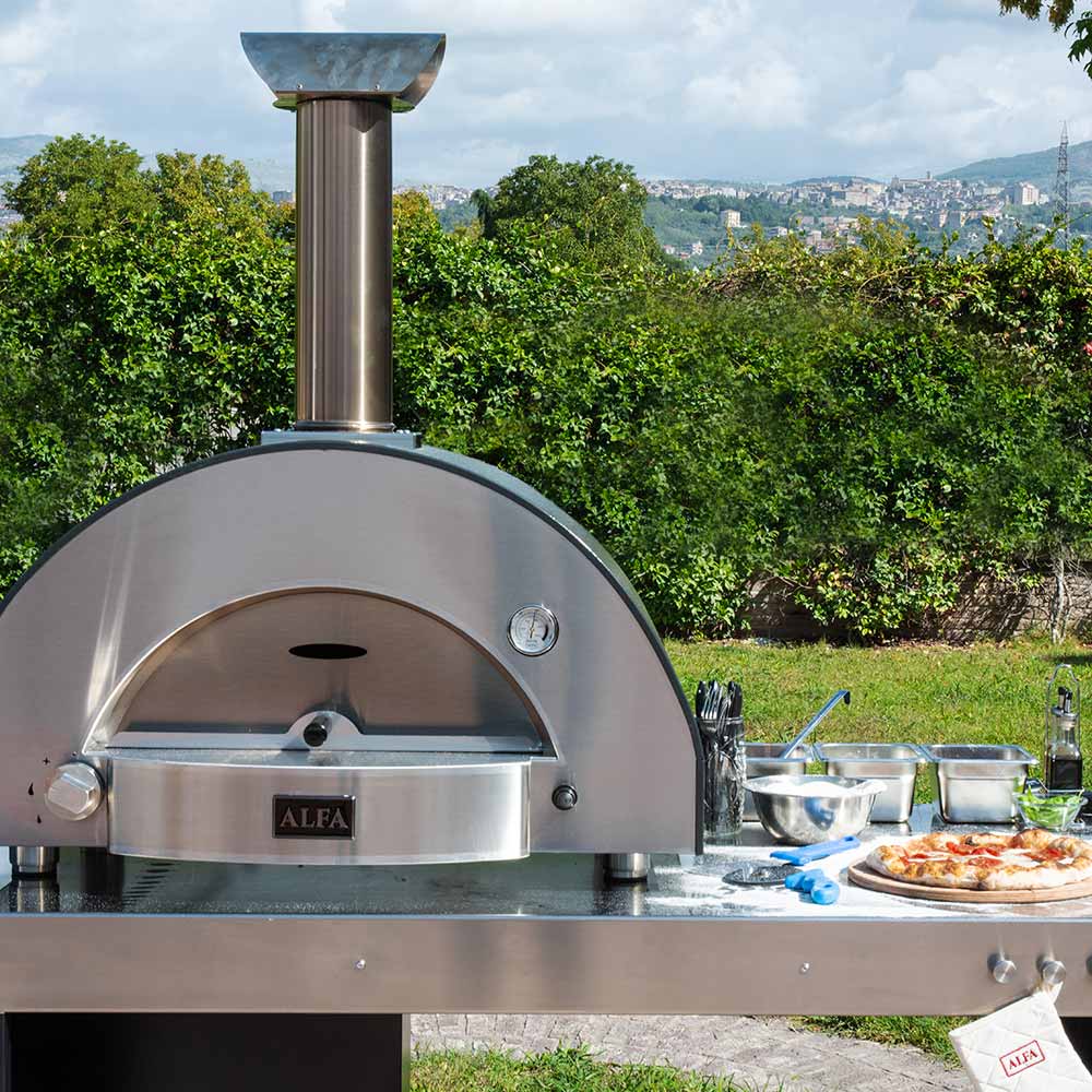Alfa gas pizza oven outdoor setup with chimney and arched cooking front