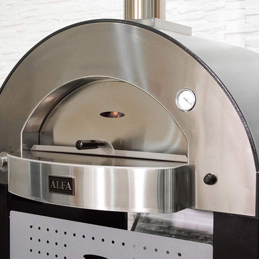 Gas pizza oven interior with stainless steel cooking chamber and handle