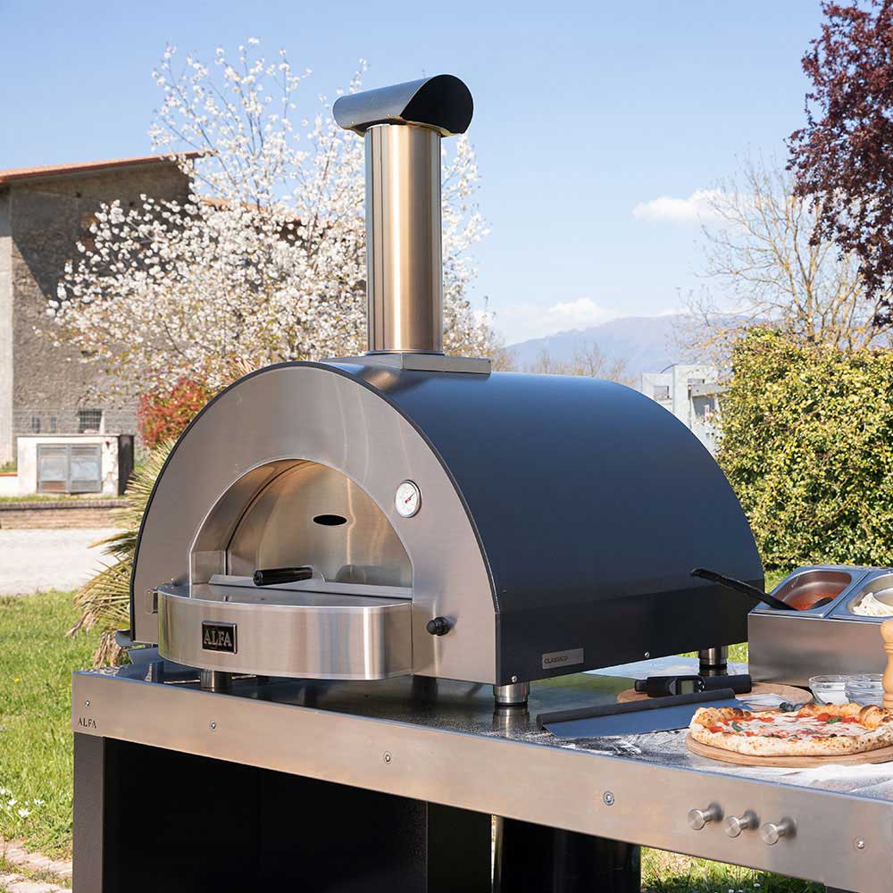 Countertop gas pizza oven with stainless front and arched open baking chamber