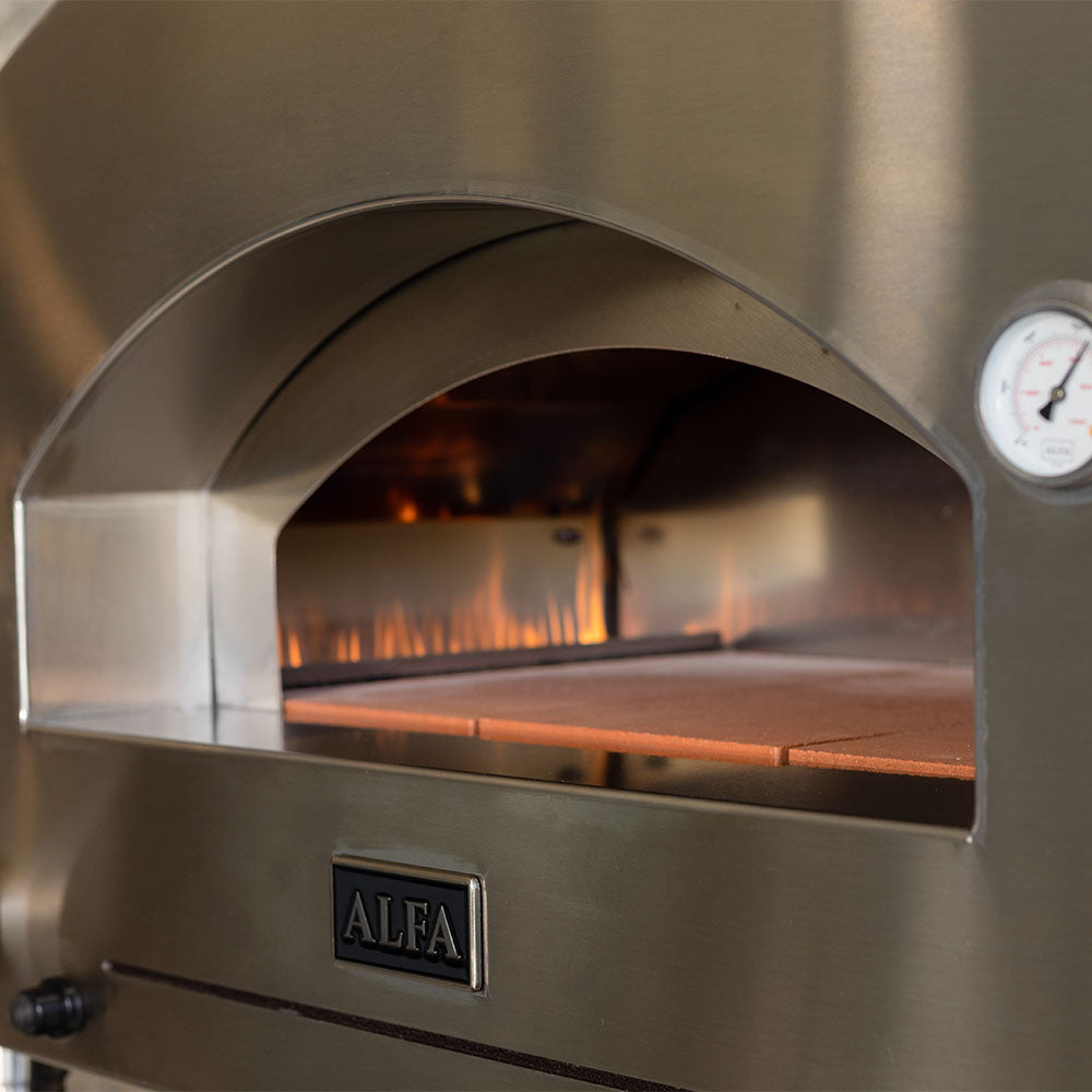 Pizza oven interior with arched opening, flame glow over stone baking surface