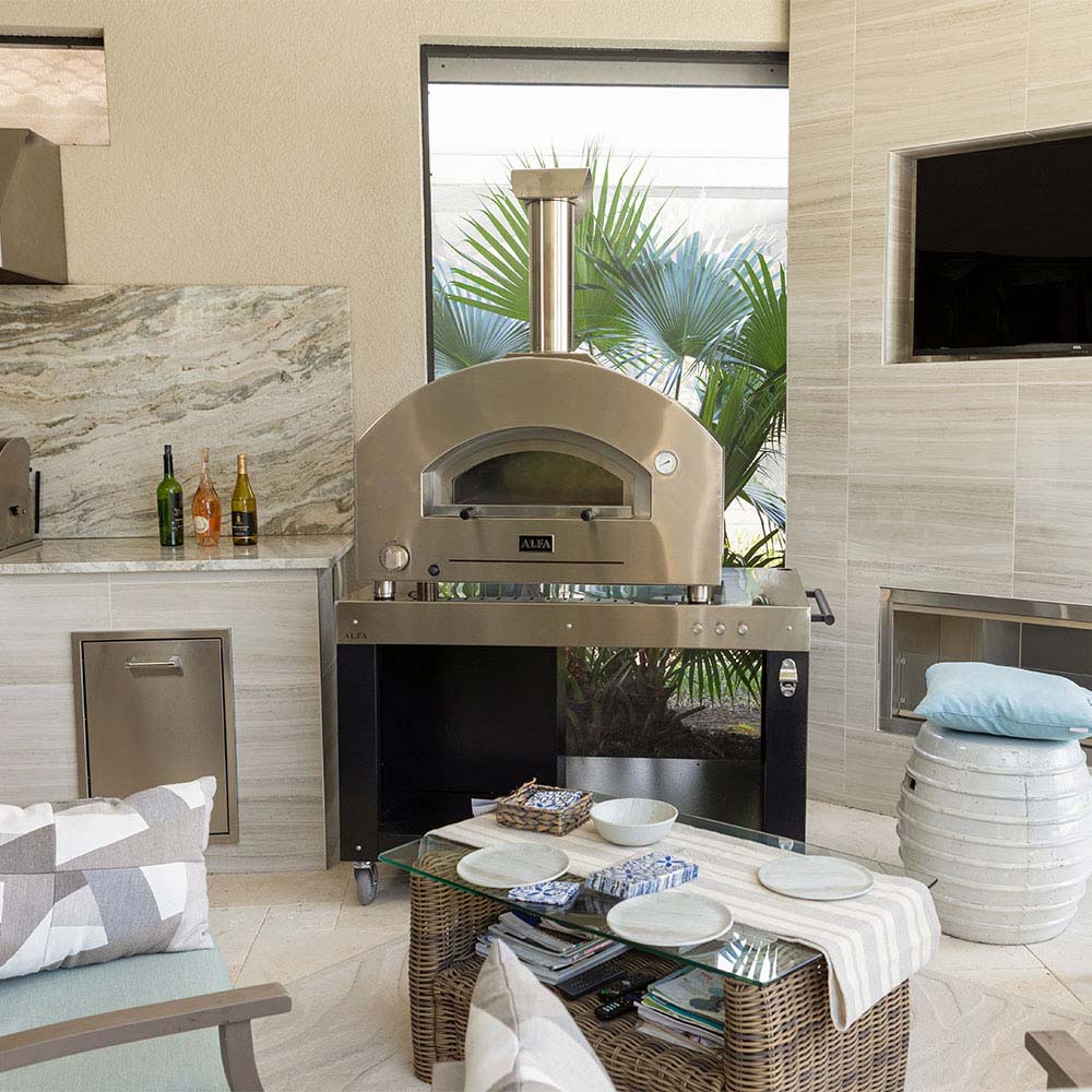 Outdoor pizza oven on cooking station, open dome above stone baking surface