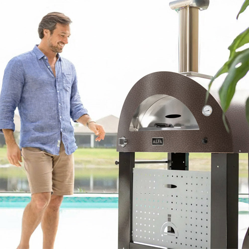 Freestanding gas pizza oven with dark dome, front perforated door panel and chimney