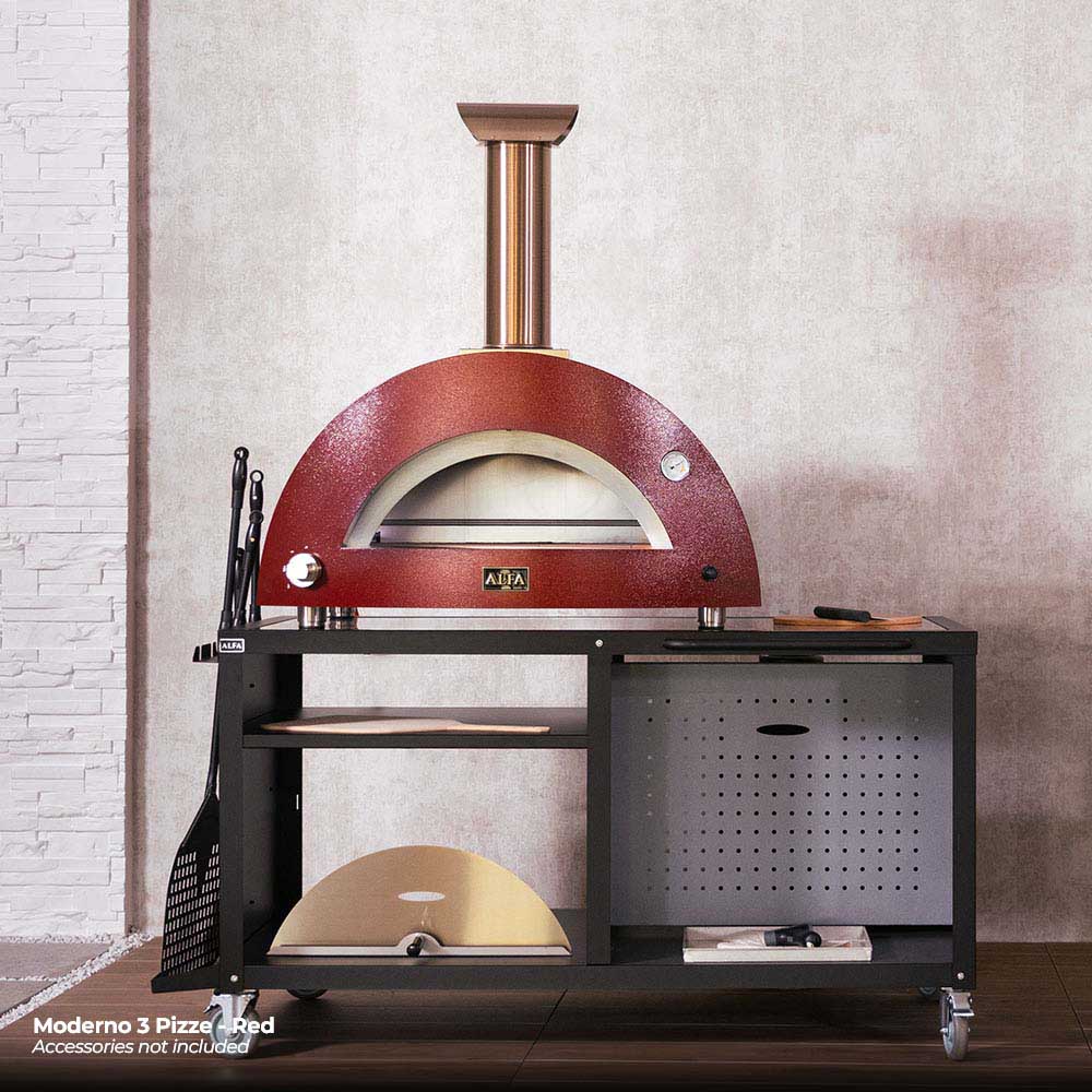 Ruby red gas pizza oven with stainless chimney, arched baking opening, and black side table