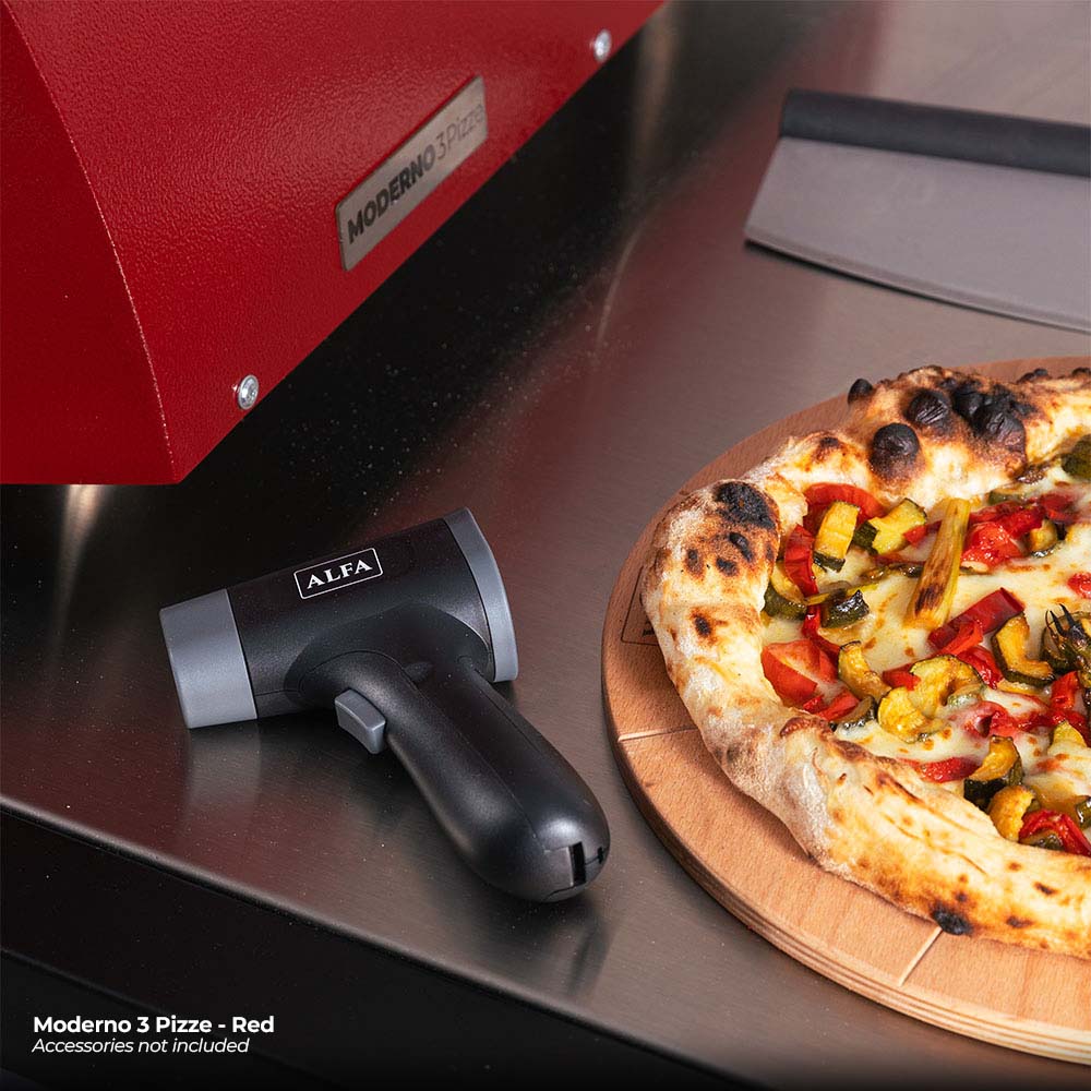 Ruby red gas pizza oven front with control knob and pizza on wooden board