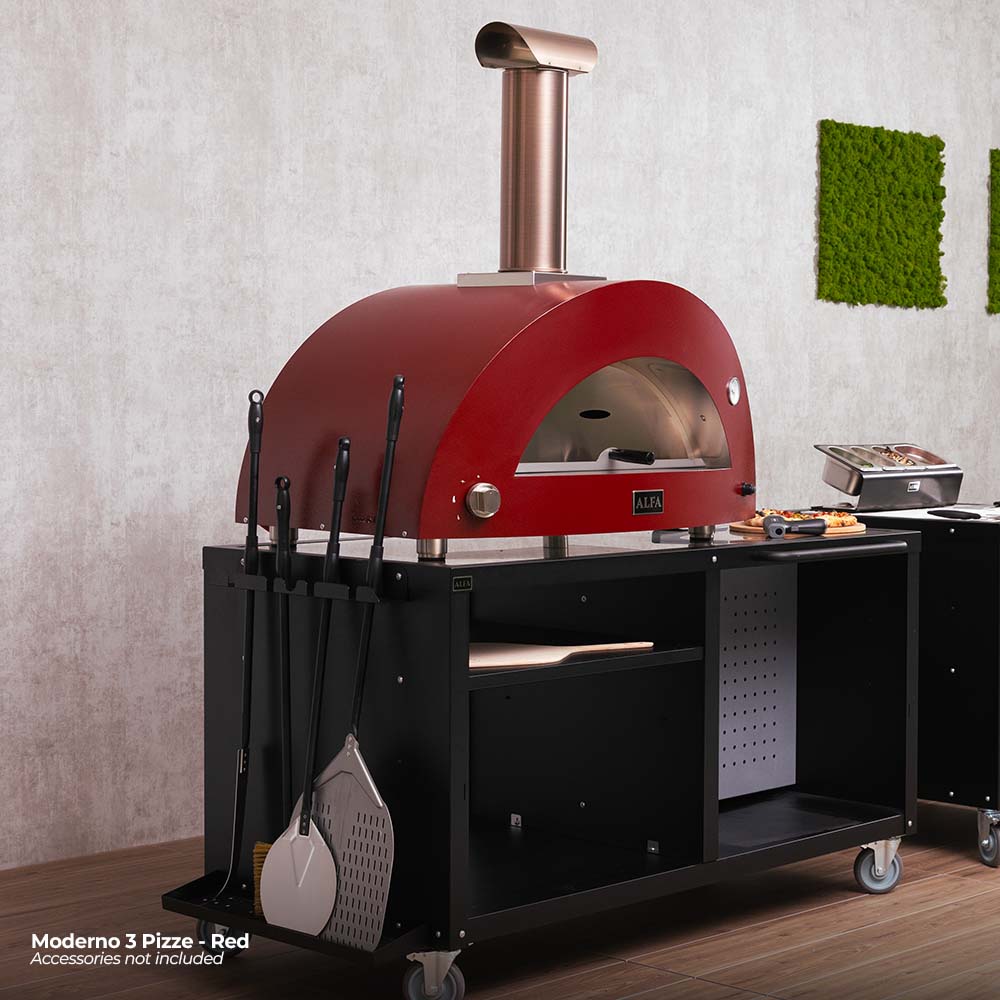 Red wood-fired pizza oven on black cart with chimney and tool holders