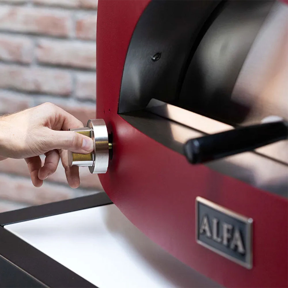 Red pizza oven front with ALFA label and knob for controls