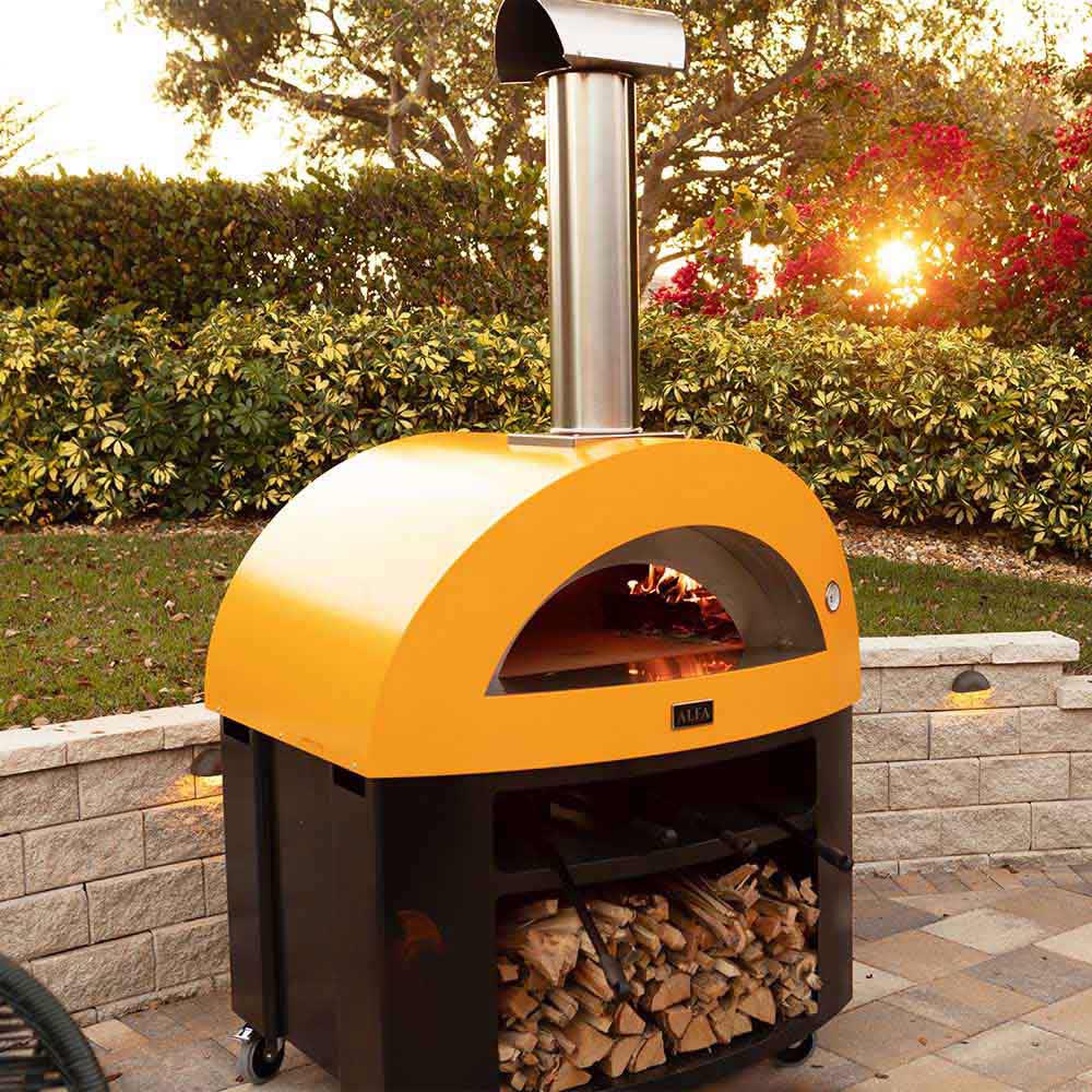 Freestanding gas pizza oven with yellow dome, vertical chimney, and stacked fire logs