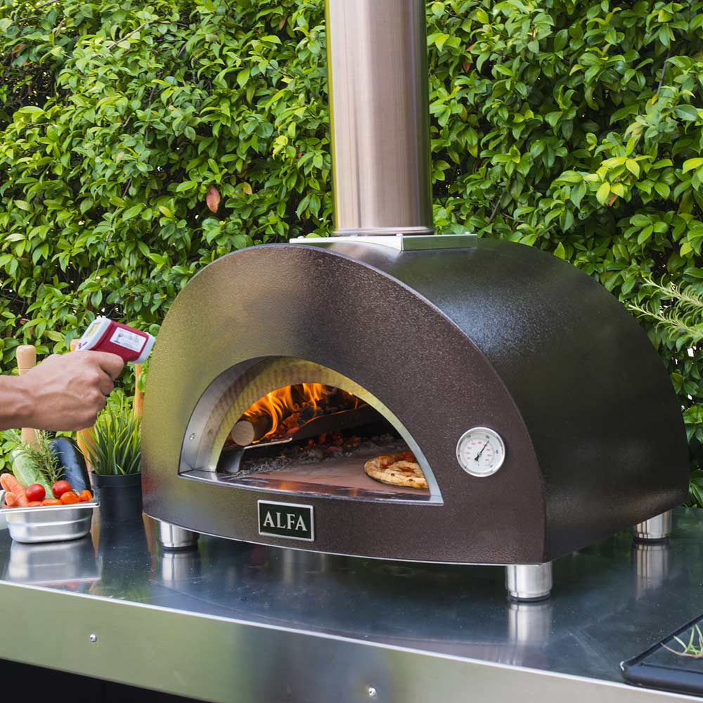 Wood-fired pizza oven with open arched chamber showing flames inside, ALFA label on door