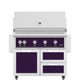 Freestanding gas grill with purple control panel and stainless doors and drawers
