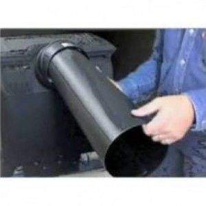 Through-wall vent duct with flanged opening and round pipe, shown during installation