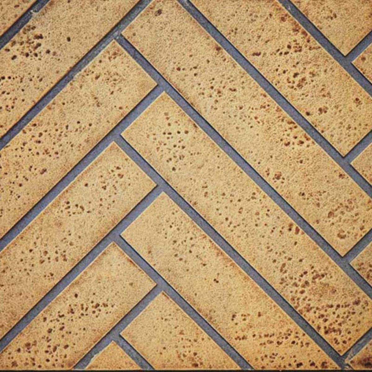 Decorative fireplace panel, herringbone sandstone pattern with gray trim