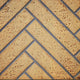 Decorative fireplace panel, herringbone sandstone pattern with gray trim
