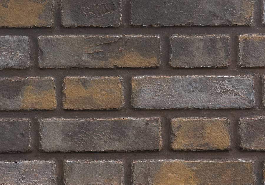 Decorative brick-pattern wall panel with dark gray and tan rectangular blocks