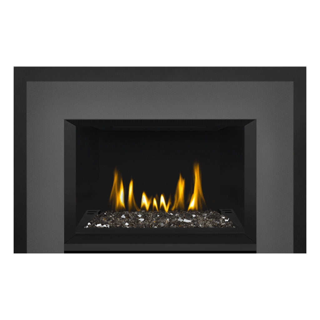 Direct vent gas fireplace insert with glass ember bed in black frame, flames in center.