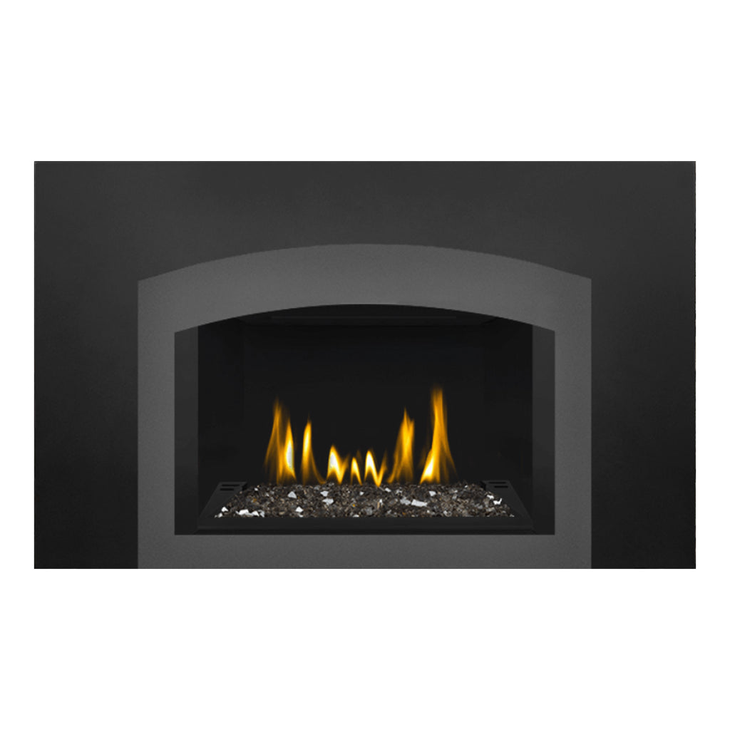Direct vent gas fireplace insert with dark glass front, ember bed and flame glow