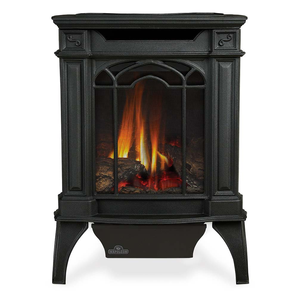 Black cast iron direct vent stove with glass front and lit fire view