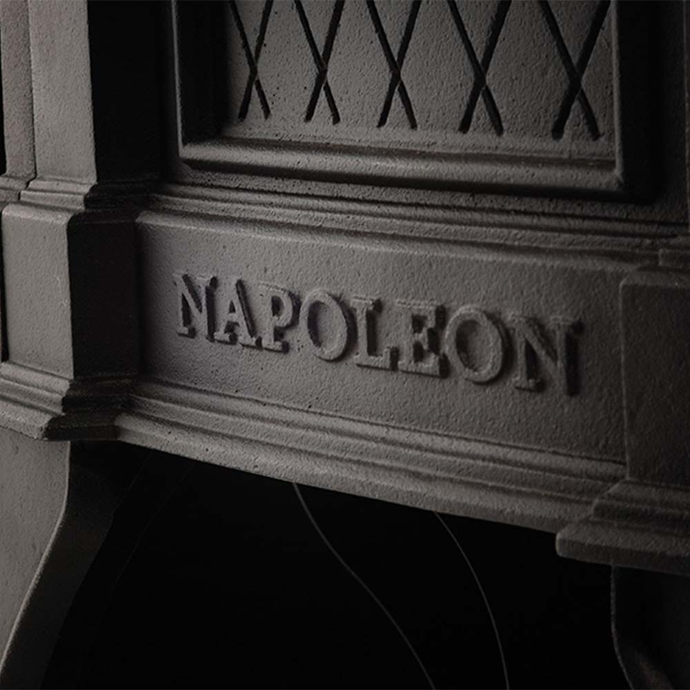 Cast iron stove base with Napoleon lettering and raised trim