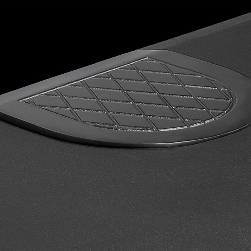 Black gas stove top vent cover with circular grid pattern