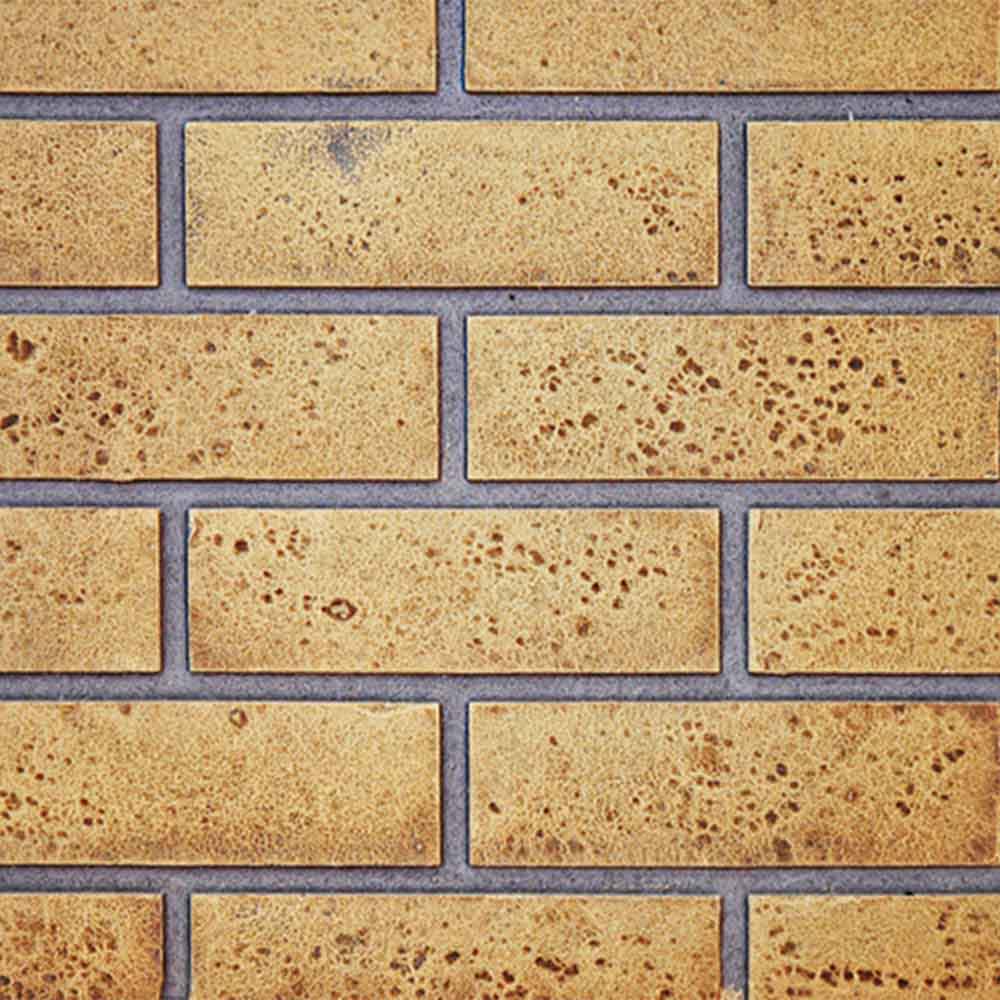 Tan brick-style backdrop panel with blue grout lines