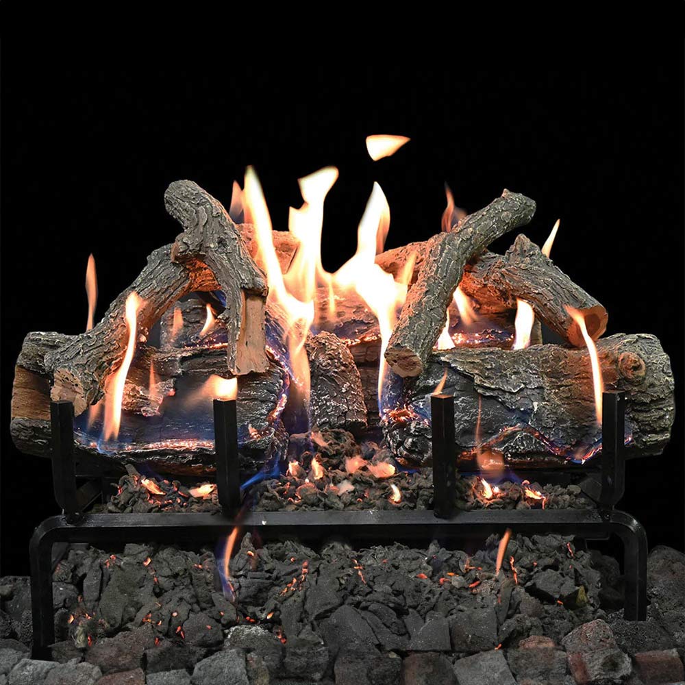 Charred wood gas log set burning with bright flames and black metal grate