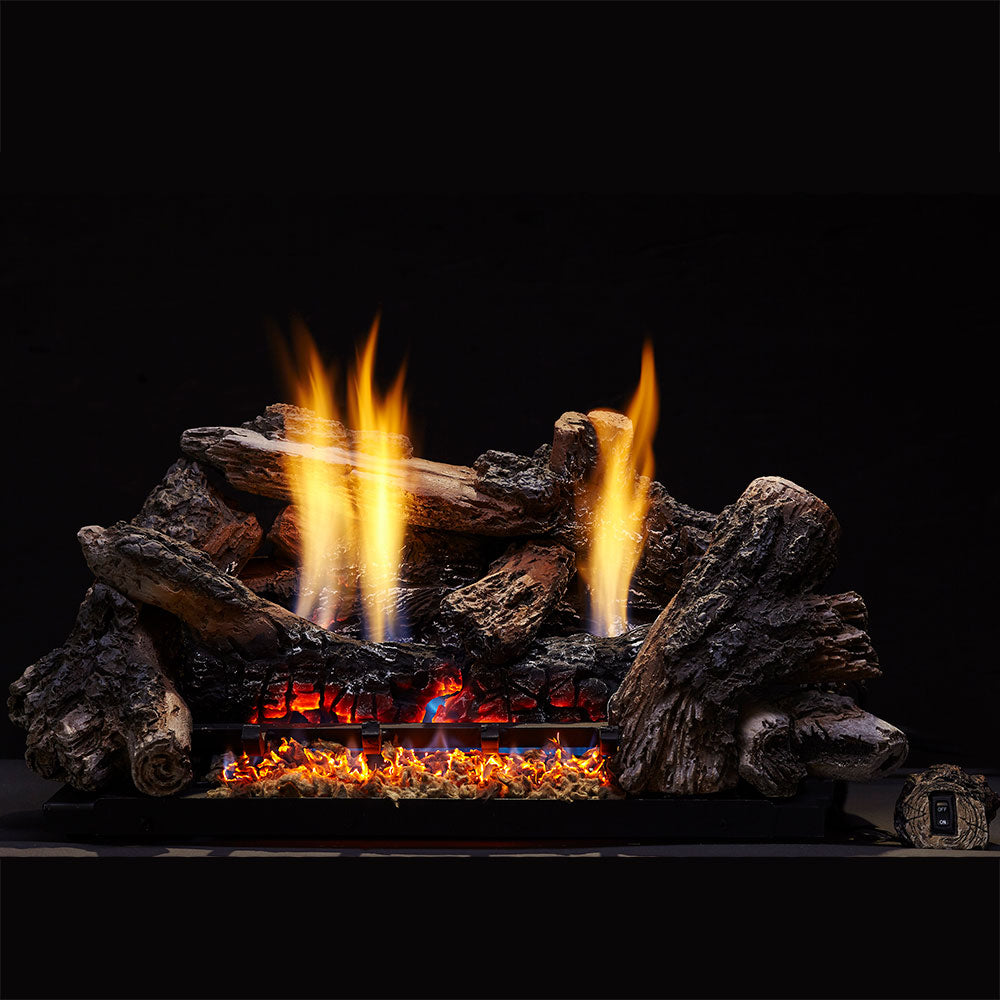 Vent-free gas log set with glowing flames over dark charred logs in a fireplace