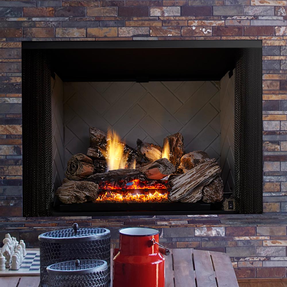 Vent-free gas log set burning in a fireplace firebox with glowing ember bed