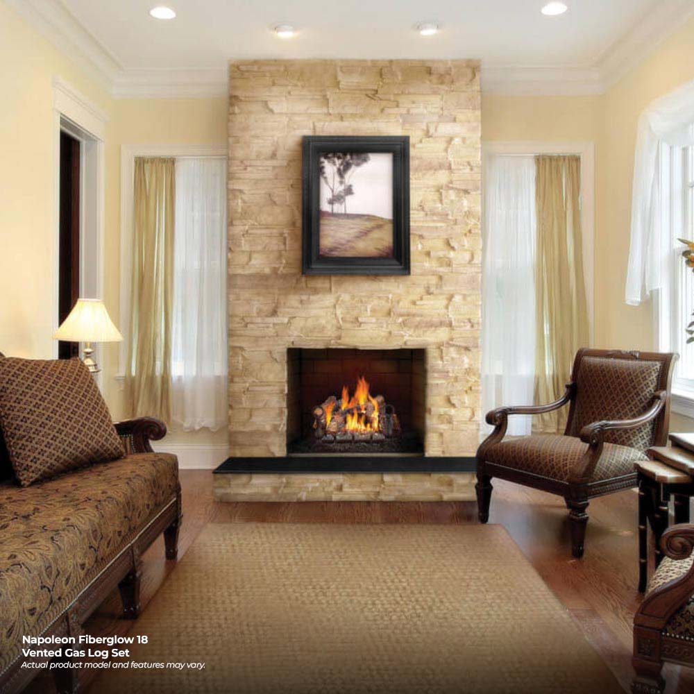Vented gas log set in a fireplace with glowing flames and dark logs