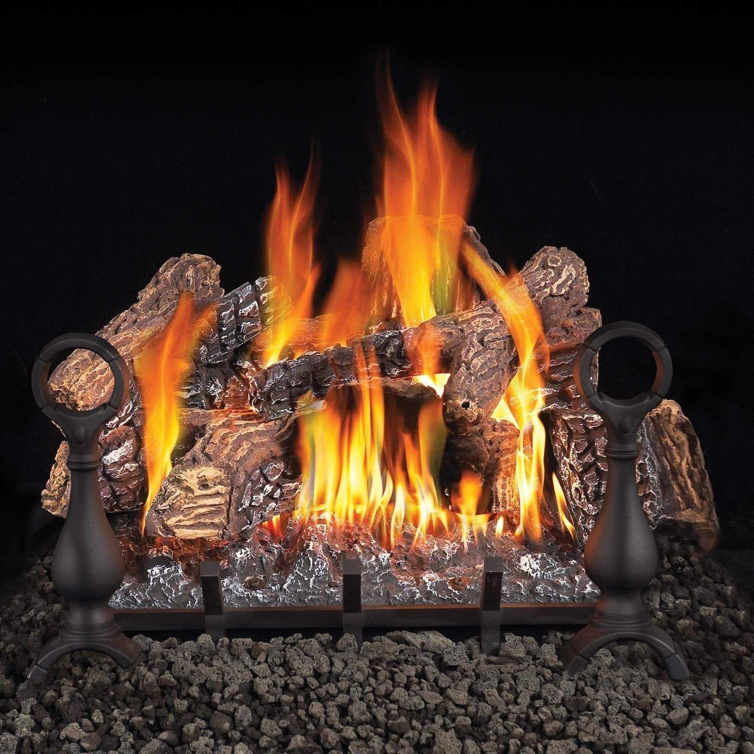 Vented gas log set with multiple flames, dark logs, and black burner columns on lava rocks
