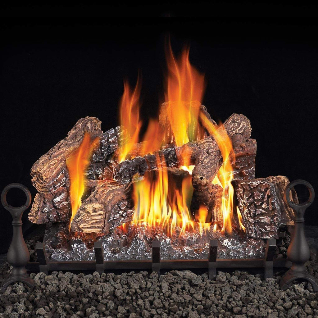 Vented gas log set with tall flames, charred logs on black grate and rock base