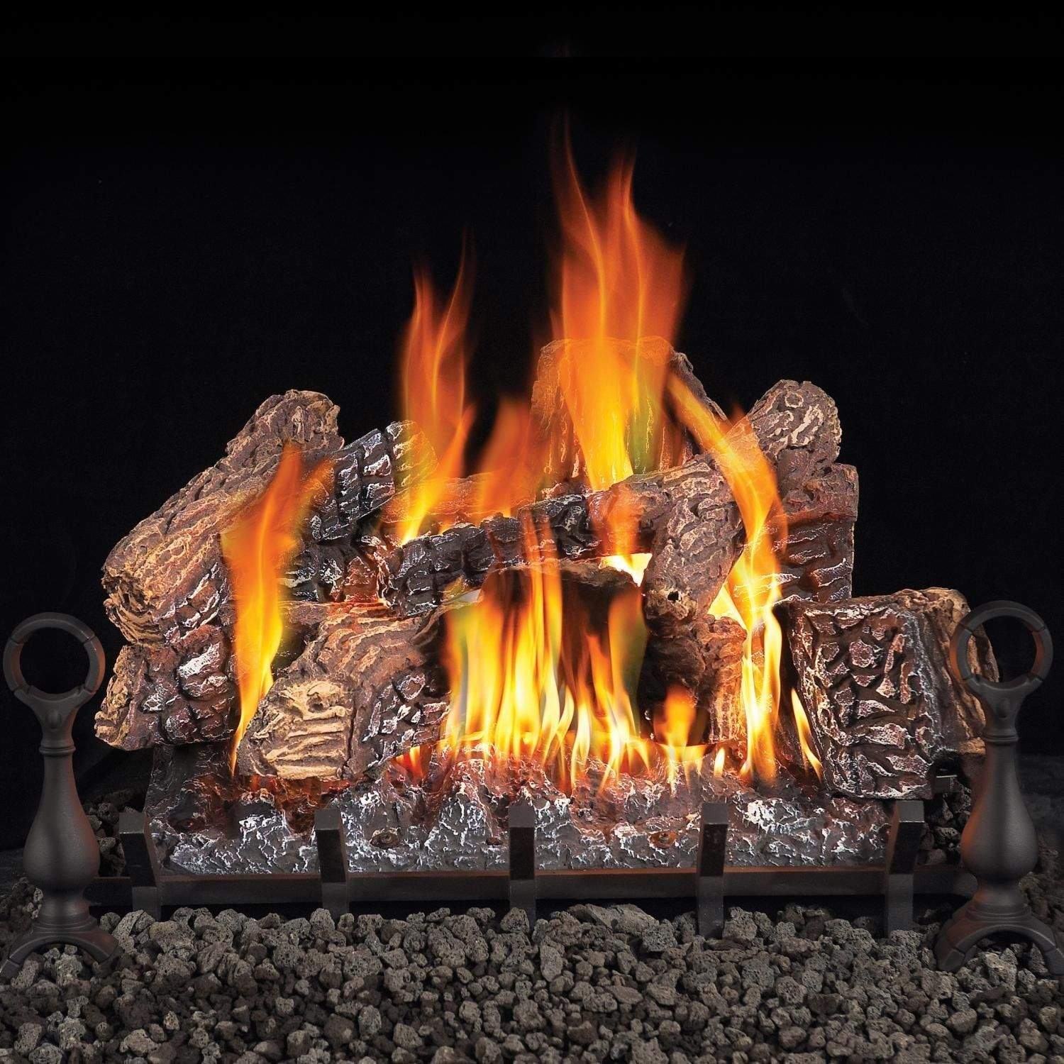 Vented gas log set with tall flames, charred logs on black grate and rock base