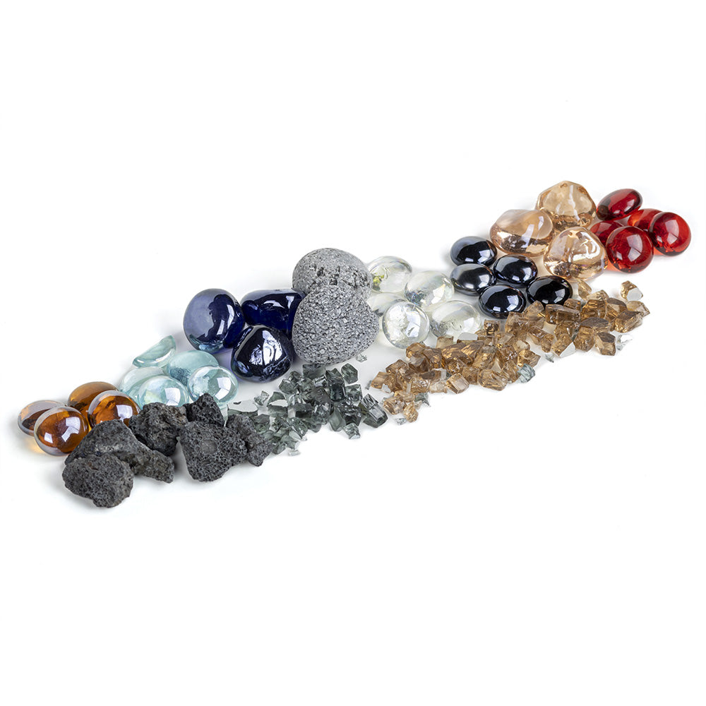 Mixed fire glass and lava rock assortment scattered with dark rocks and multicolor glass pieces