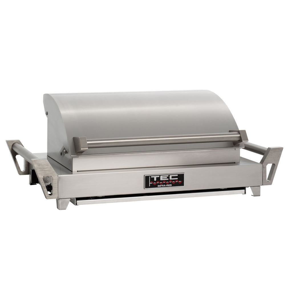 Tabletop infrared grill with lid closed, side handles, stainless steel body, side view