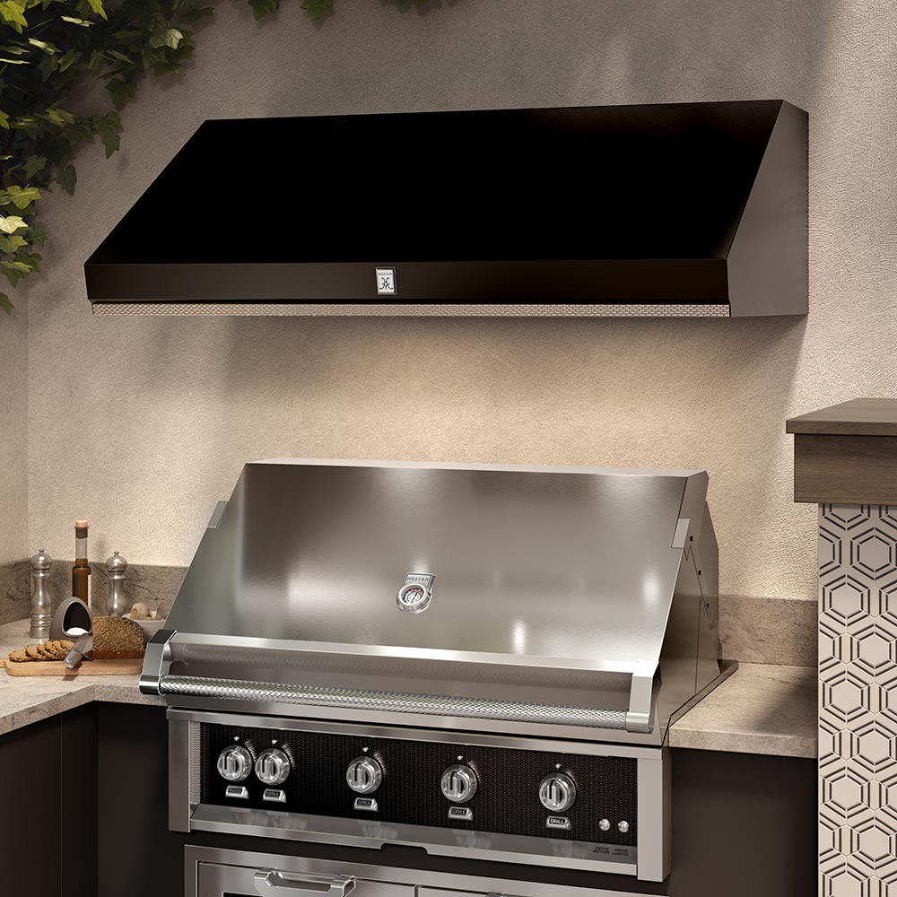Stainless steel outdoor ventilation hood with front control panel and center emblem.