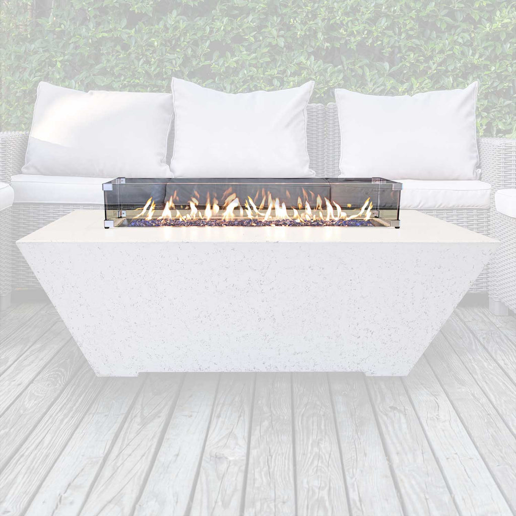 Rectangular glass wind guard on concrete fire pit with flames visible behind glass